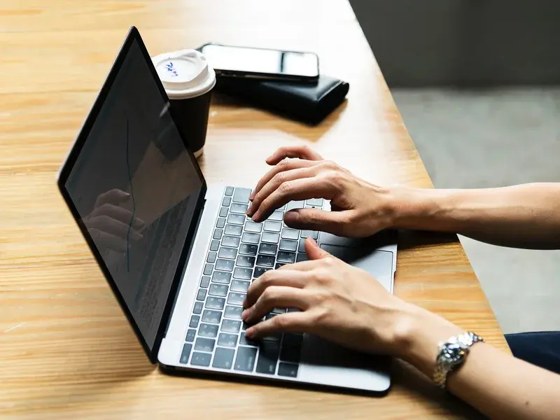 Hand and laptop